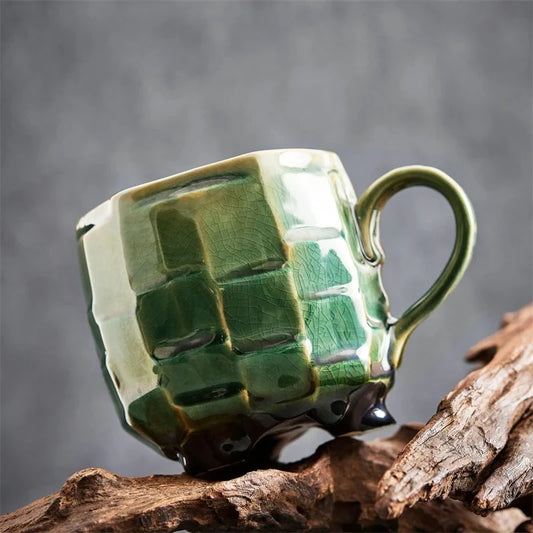 Green Japanese Tea Cup standing on a piece of wood