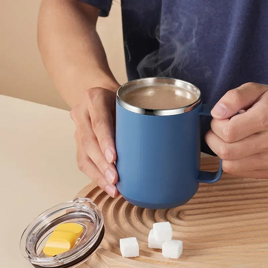 Person Holding Blue Camping Mug With Hot Chocolate Inside