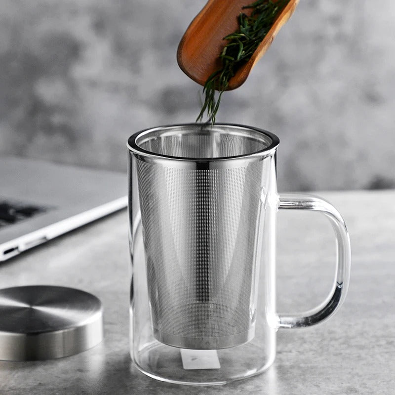 Person Pouring Ingredients Into Tea Mug With Infuser