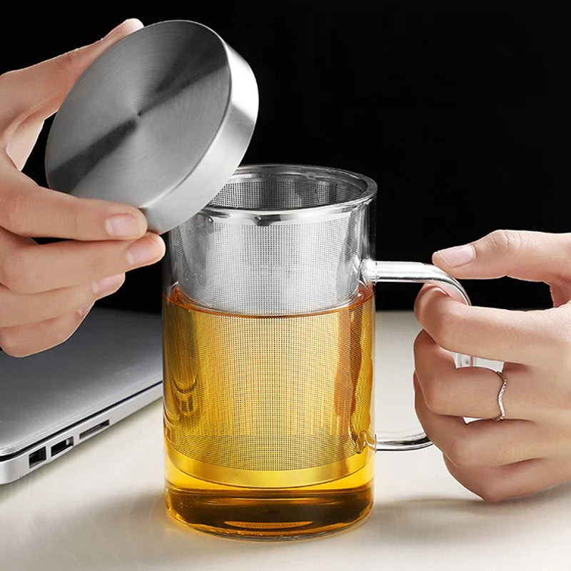 Person Holding The Lid of Tea Mug With Infuser